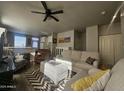 Inviting living room with comfortable seating, neutral tones, and lots of natural light at 650 N Hawes Rd # 3312, Mesa, AZ 85207