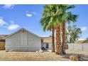 Charming home featuring palm trees, rock landscaping, and a well-maintained exterior at 7431 W Mclellan Rd, Glendale, AZ 85303
