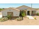 Inviting single-story home boasting desert landscaping, stone details, and a durable tile roof at 1623 E Hidalgo St, Apache Junction, AZ 85119