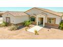 Beautiful single-story house with a well-maintained front yard, stylish stone accents, and a welcoming entrance at 1623 E Hidalgo St, Apache Junction, AZ 85119