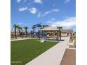 Beautifully landscaped community playground with modern equipment, shaded picnic area, and green space at 18188 W Sonora St, Goodyear, AZ 85338