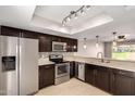 Bright kitchen showcases stainless steel appliances, dark cabinets, and stylish pendant lighting at 19601 N 7Th St # 1022, Phoenix, AZ 85024
