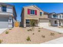 Two-story home with a two-car garage, a well kept yard, and privacy fence at 22863 N 183Rd Dr, Surprise, AZ 85387
