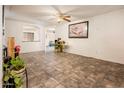 Bright living room with tile floors, offering a clean and neutral space for relaxation at 2721 N 107Th Dr, Avondale, AZ 85392