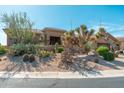 Charming desert-landscaped home with natural rock features and mature landscaping at 28768 N 95Th Way, Scottsdale, AZ 85262