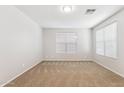 Spacious living room with carpet flooring and neutral paint, filled with natural light at 3013 W Via De Pedro Miguel --, Phoenix, AZ 85086