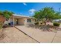 Attractive one-story home showcasing a covered carport, desert landscaping, and a lovely curbside appeal at 3118 W Aster Dr, Phoenix, AZ 85029