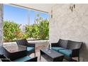 Relaxing patio with outdoor seating, offering a serene space surrounded by lush greenery at 3314 N 68Th St # 129, Scottsdale, AZ 85251
