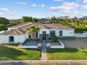 Beautiful single-story home with a well-manicured front yard and desert landscaping at 3354 E Jaeger Cir, Mesa, AZ 85213