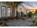 Elegant home exterior featuring desert landscaping and a stylish walkway to the front door at 3354 E Jaeger Cir, Mesa, AZ 85213