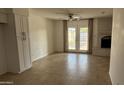 Inviting living area with fireplace, tile flooring, and direct access to the backyard patio at 4217 W Medlock Dr, Phoenix, AZ 85019