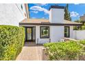 Charming front entry with a decorative wreath, a brick walkway and professionally designed landscaping at 5435 E Cambridge Ave, Phoenix, AZ 85008