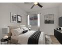 Comfortable bedroom with neutral colors, stylish decor, and a large window for ample sunlight at 1610 N Apache Dr, Chandler, AZ 85224