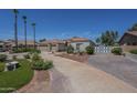 Inviting single-level home with a circular driveway and mature landscaping at 17770 N 66Th Ln, Glendale, AZ 85308