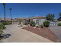 A wide view of a well-maintained single-Gathering home with desert landscaping at 17770 N 66Th Ln, Glendale, AZ 85308
