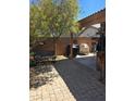 Outdoor patio area featuring a covered dining area, grill, and lush landscaping at 2125 E Danbury Rd, Phoenix, AZ 85022