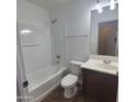 Clean, white bathroom featuring a tub/shower combo, modern fixtures, and a stylish vanity at 2367 E Huntington Dr, Phoenix, AZ 85040