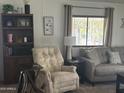 Cozy living room showcases comfortable seating and a bright window view at 300 S Val Vista Dr # 54, Mesa, AZ 85204