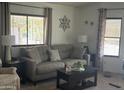Comfortable living room featuring a neutral color scheme and a decorative wall design at 300 S Val Vista Dr # 54, Mesa, AZ 85204
