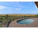Inviting outdoor pool area features mountain views and a beautifully landscaped patio at 6349 E Hummingbird Ln, Paradise Valley, AZ 85253