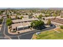 Scenic aerial view of a well-maintained neighborhood with lush greenery and tile-roofed homes at 64 N 63Rd N St # 33, Mesa, AZ 85205