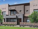 Contemporary townhome with a unique facade, complemented by lush landscaping and architectural details at 733 E Commonwealth Ave # 36, Chandler, AZ 85225