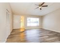 Bright living room features wood-look floors and a ceiling fan at 9622 N 35Th Ln, Phoenix, AZ 85051