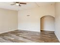 Open living room features wood-look floors and a ceiling fan at 9622 N 35Th Ln, Phoenix, AZ 85051