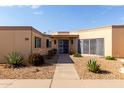 Charming single-story home with a xeriscaped front yard and covered entryway at 13889 N 108Th Dr, Sun City, AZ 85351