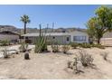 Charming single-story home featuring desert landscaping and a covered carport at 1413 E Dobbins Rd, Phoenix, AZ 85042
