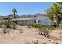 Charming single-story home featuring desert landscaping and a covered carport at 1413 E Dobbins Rd, Phoenix, AZ 85042