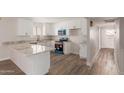 Bright kitchen with stainless steel appliances, white cabinetry, and granite countertops at 1413 E Dobbins Rd, Phoenix, AZ 85042