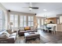 Bright living room featuring large windows and comfortable seating arrangements at 15221 N Clubgate Dr # 2096, Scottsdale, AZ 85254