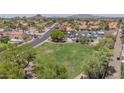 An aerial shot showcases the green space and convenient location near a park and recreational vehicle parking at 1549 N La Rosa Dr, Tempe, AZ 85288