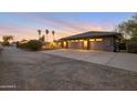 Three car garage with extra long driveway in front of custom home at 22039 N 86Th Ave, Peoria, AZ 85383