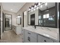 Luxury bathroom with double vanity, sleek fixtures, and walk-in shower offers a spa-like experience at 25846 W Denver Hill Dr, Wittmann, AZ 85361