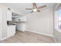 Updated kitchen with white cabinets, modern countertops, and stainless steel appliances at 286 W Palomino Dr # 147, Chandler, AZ 85225