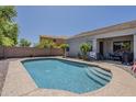 Refreshing private pool with a patio area, perfect for outdoor relaxation and entertaining in the backyard at 2976 E Clifton Ave, Gilbert, AZ 85295