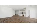 Open concept living room showcasing wood-look tile floors at 35765 N King Ln, San Tan Valley, AZ 85140