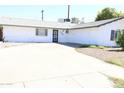 Charming single-story home featuring a well-maintained white exterior and spacious driveway at 3651 W Mariposa St, Phoenix, AZ 85019