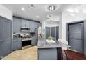 Well-equipped kitchen with stainless steel appliances, including a gas range, and gray cabinets at 945 E Playa Del Norte Dr # 4019, Tempe, AZ 85288