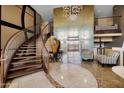 Elegant lobby featuring a staircase, elevator, stylish furniture, and contemporary lighting fixtures at 945 E Playa Del Norte Dr # 4019, Tempe, AZ 85288