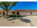 Charming single-story home with stone accents, desert landscaping and a two-car garage in a sunny neighborhood at 11360 E Keats Ave # 92, Mesa, AZ 85209