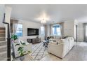 Bright living room with neutral colors, plush seating, large windows and stylish decor at 13237 W Redstone Dr, Peoria, AZ 85383