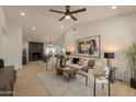 Bright living room featuring vaulted ceilings, modern furnishings, and an open floor plan at 1609 W Yukon Dr, Phoenix, AZ 85027