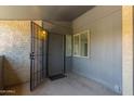 Private entryway featuring a secure gate, covered area, and direct access to the home at 1730 W Emelita Ave # 2033, Mesa, AZ 85202