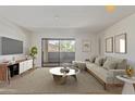 Bright living room featuring a stylish couch, modern decor, and sliding glass doors to outdoor balcony at 1730 W Emelita Ave # 2033, Mesa, AZ 85202