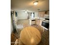 The kitchen and dining area offer a practical layout with ample space at 201 S Greenfield Rd # 118, Mesa, AZ 85206