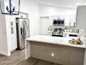 Bright kitchen with modern cabinets, stainless appliances, and quartz countertops at 20917 N 37Th Pl, Phoenix, AZ 85050