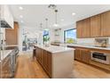 Gourmet kitchen features a large island, custom cabinets, and modern appliances perfect for entertaining at 3800 E Lincoln Dr # 54, Phoenix, AZ 85018